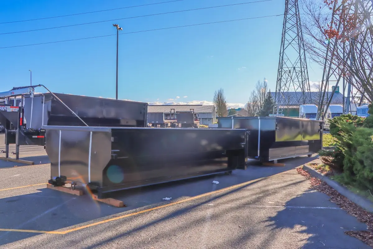 Roll-off dumpster ready for waste disposal at job site for Yard Waste Dumpster Rental in Venersborg